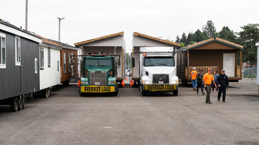 Manufactured homes getting transported from the factory